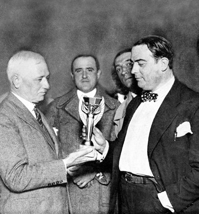 Jules Rimet hands the Jules Rimet Cup™ to the Uruguayan Football Confederation, 1930
